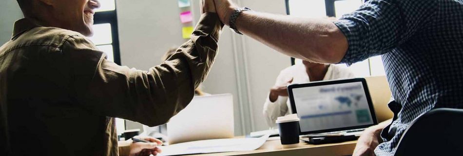 Colleagues giving a high five