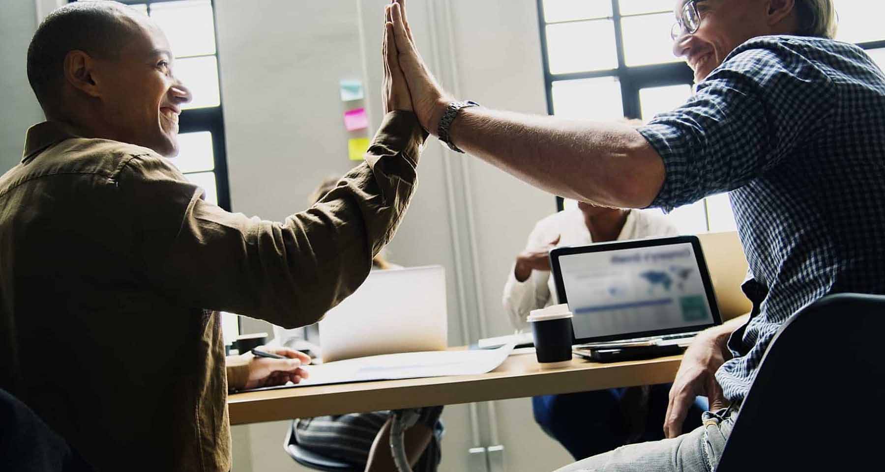 Colleagues giving a high five